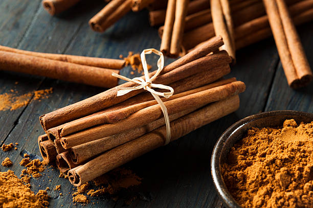 organic raw brown cinnamon on a background
